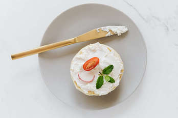 Burger bun with spread cheese